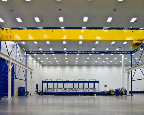 Interior of Spirit AeroSystems Composite Center. Large open room with fluorescent lighting.